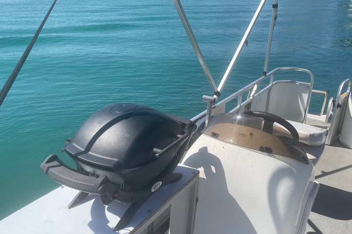 a boat is docked next to a body of water