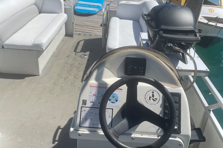 a motorcycle is parked on the side of a boat