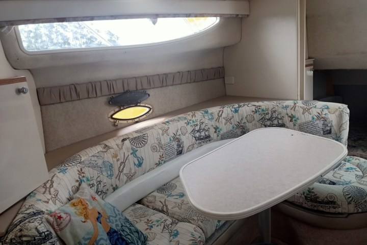 Luxury bayliner cruiser - seas the day - bedroom with a bed and a window Forster NSW
