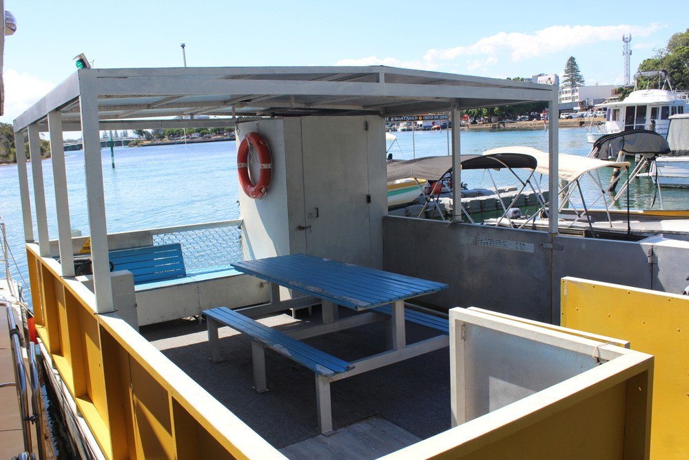 Big Yella BBQ Party Barge with onboard toilet on Wallis Lake Forster NSW — a spacious boat hire option for large groups